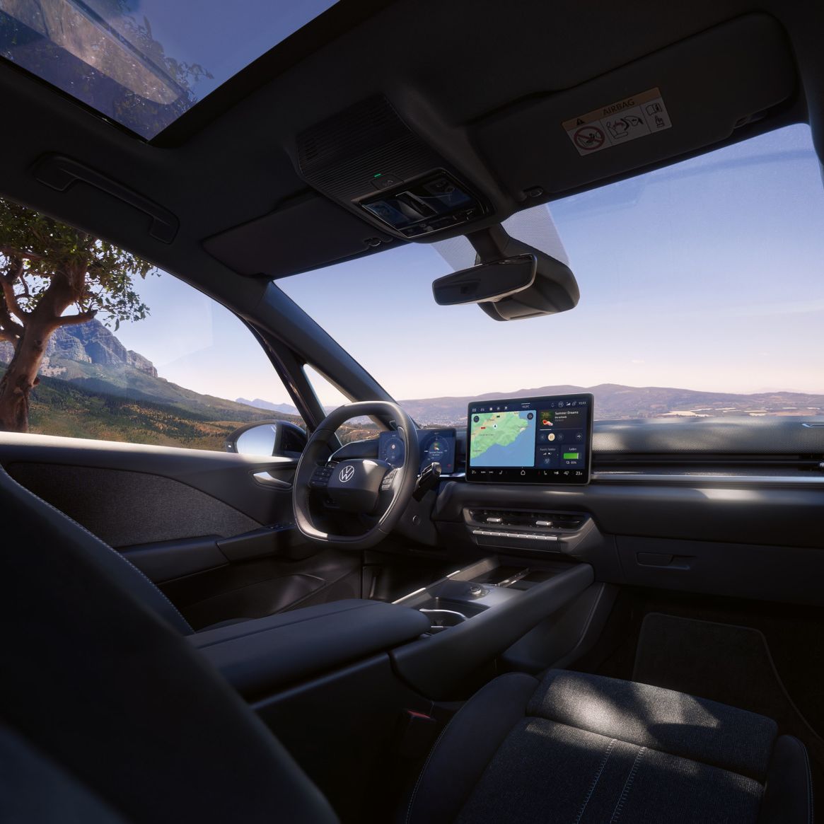 Fahrersitz und Cockpit eines VW ID.3 Neo, vom Beifahrersitz aus gesehen