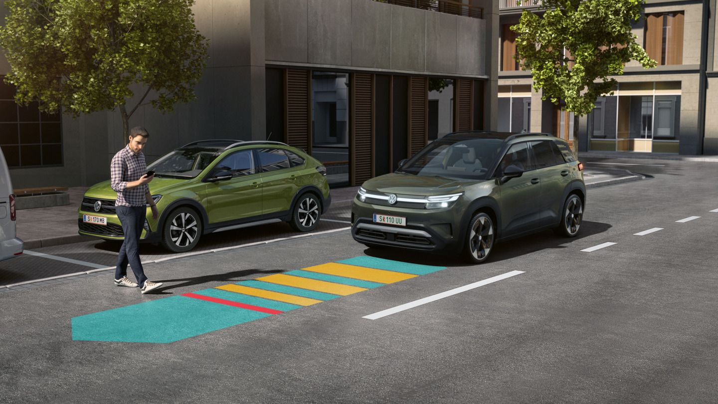 Илюстрацията схематично показва функционалността на Front Assist чрез зелен VW ID. Cross
